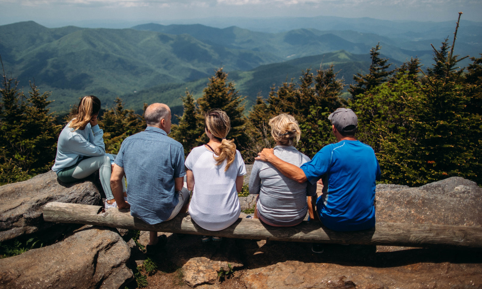 Group of people enjoying scenic RV travel views in the Blue Ridge Mountains.