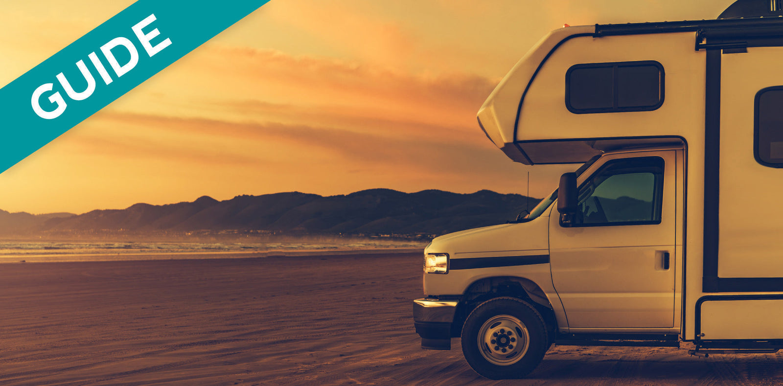 RV parked on a beach at sunset, with "GUIDE" overlayed.