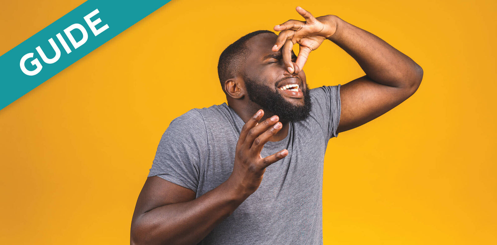 Man pinching nose due to RV toilet smell when flushing.