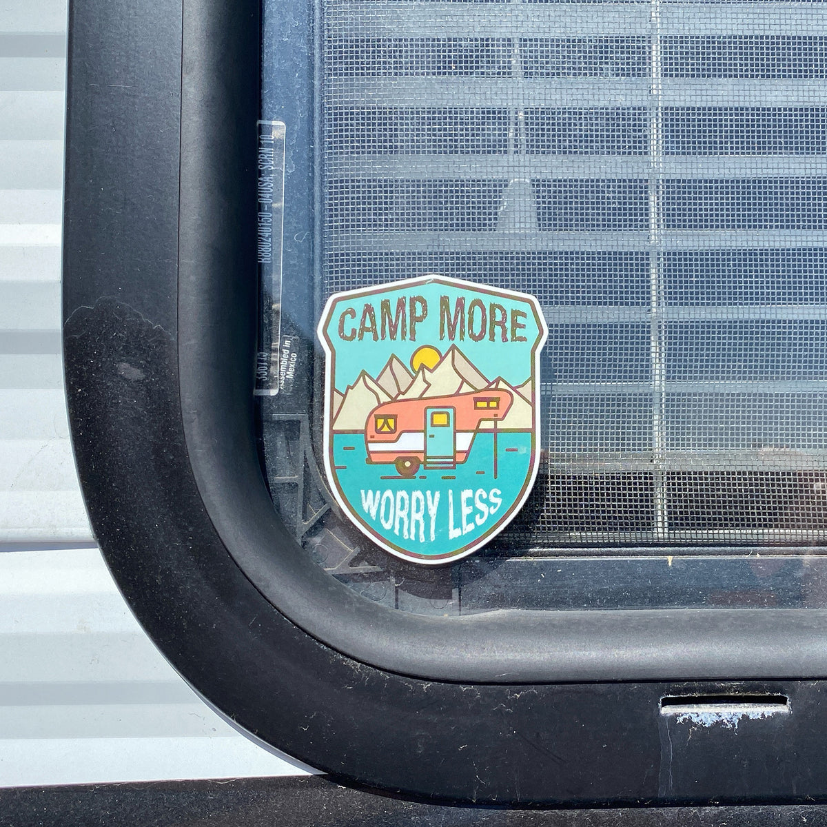 Camp more. Worry Less sticker on an RV Window. Unique Camping + Marine